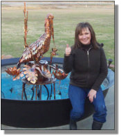 New owner Donna with her Pelican fountain in New Iberia, LA