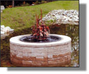 Madison Five fountain with kettle used as insert in nice brick surround in Maine