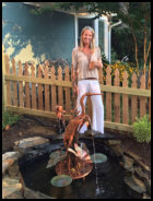 Copper Egret fountain with pretty customer
