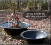 Two of our fiberglass sugar kettles with copper heron outdoor fountain