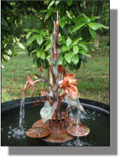 Lance One accent copper fountain with orchids