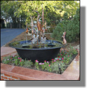 Cypress Heron copper fountain customized to include Peter Rabbit, a frog and a jaybird in the tree