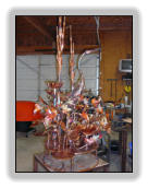 Copper heron fountain in shop as it is being completed.