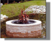 Madison Five fountain with kettle used as insert in nice brick surround in Maine