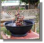 Big kettle and fountain on nice brick pad
