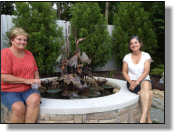 Beverlye with her niece next to the Chicago Heron fountain she bought recently. 