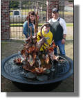 Thibodaux family with their new copper fountain and sugar kettle