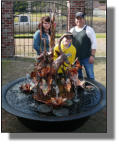 Thibodaux family with their new copper fountain and sugar kettle