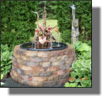 Great wishing well type brickwork with Heron fountain