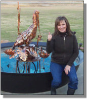 New owner Donna with her Pelican fountain in New Iberia, LA
